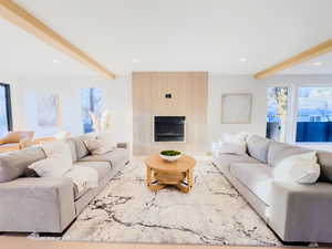 Living room featuring a fireplace and beamed ceiling