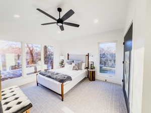 Bedroom with ceiling fan and vaulted ceiling