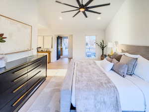 Bedroom with ensuite bathroom and light hardwood / wood-style floors