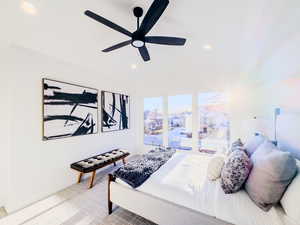 Carpeted bedroom with ceiling fan