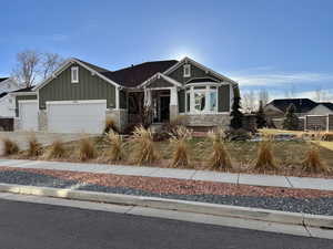 Craftsman house featuring a garage