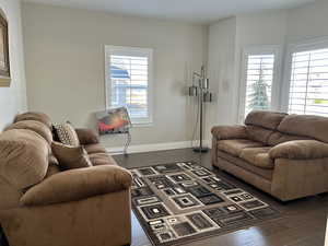 Living room featuring dark hardwood / wood-style floors