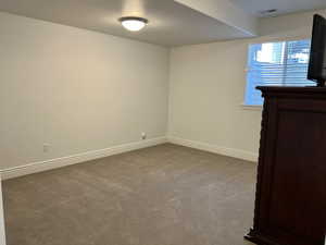 Empty room with carpet flooring