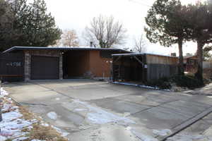 View of side of property featuring a garage