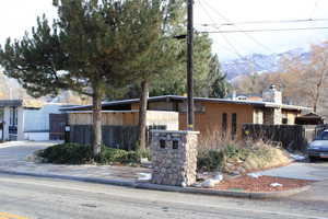 View of side of property featuring a mountain view