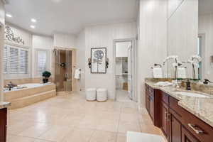 Bathroom with tile patterned flooring, vanity, independent shower and bath, and ornamental molding