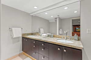 Bathroom featuring tile patterned flooring and vanity