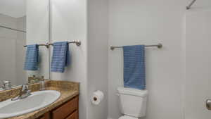 Bathroom featuring vanity and toilet