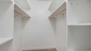 Walk in closet with carpet