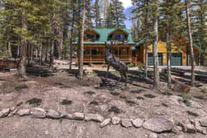 View of front of property with a porch and a garage