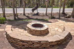 View of patio featuring an outdoor fire pit