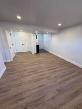 Basement with hardwood / wood-style floors