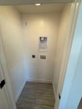 Laundry room with hookup for an electric dryer and hookup for a washing machine