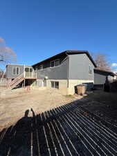 Rear view of property with a deck