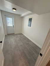 Interior space with hardwood / wood-style floors, a textured ceiling, and electric panel