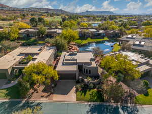 Aerial view of home featuring a water feature