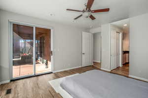 Primary bedroom with sliding doors to patio