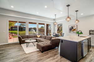 Living room and kitchen area with views of the pond and water feature