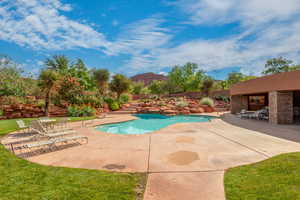 View of community pool featuring a mountain view and a patio area