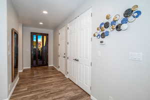 Hall with dark wood-type flooring