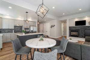 Open floor plan with dining area, kitchen, and living room