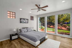 Primary Bedroom with large windows to enjoy the view of the stream and water feature