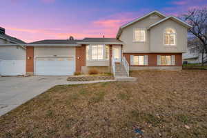 Tri-level home featuring a garage