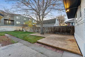 View of yard with a wooden deck