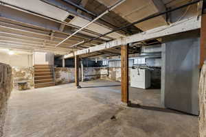 Basement featuring washer and clothes dryer