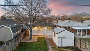 Yard at dusk with an outbuilding