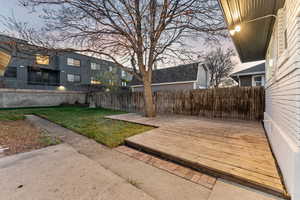 Yard at dusk with a deck