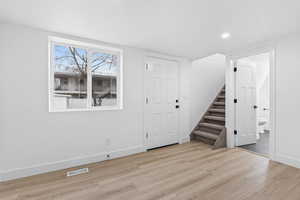 View from dining room to entrance to second level bedroom