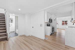 Informal dining room, laundry area, and entrance to second bathroom.