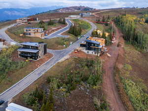 Birds eye view of property with a mountain view