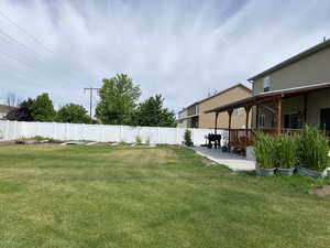 View of yard featuring a patio area and a wooden deck