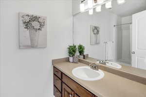 Bathroom with vanity and walk in shower