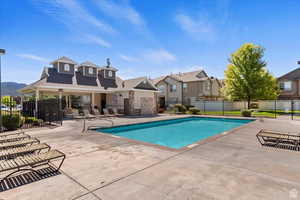 View of swimming pool with a patio area