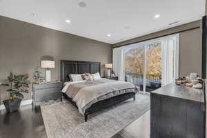 Bedroom with access to exterior and wood-type flooring