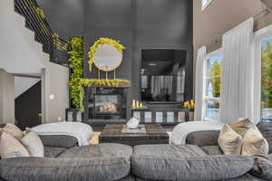 Living room featuring a high ceiling