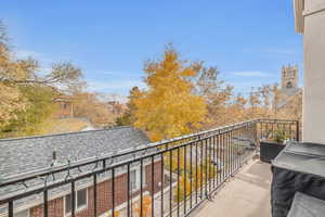 Balcony featuring a mountain view and a grill