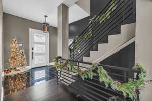 Foyer entrance featuring dark hardwood / wood-style floors