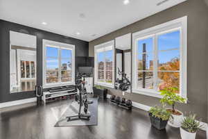 Exercise room featuring wood-type flooring