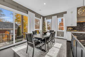 Dining room with dark wood-type flooring