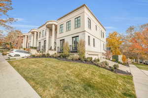 View of front of property with a front lawn