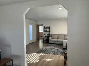 Living room with hardwood / wood-style flooring