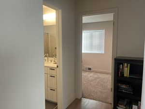 Hallway featuring light wood-type flooring