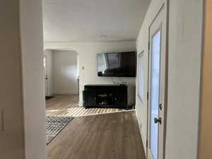 Unfurnished living room featuring hardwood / wood-style floors