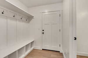 Mudroom with light wood-type flooring