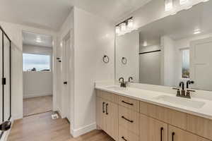 Bathroom featuring hardwood / wood-style floors and vanity