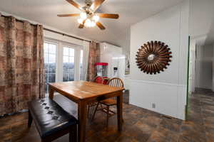 Dining room featuring ceiling fan and a textured ceiling